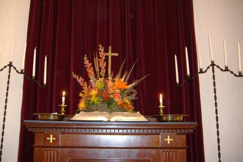 Autumn flowers on the alter